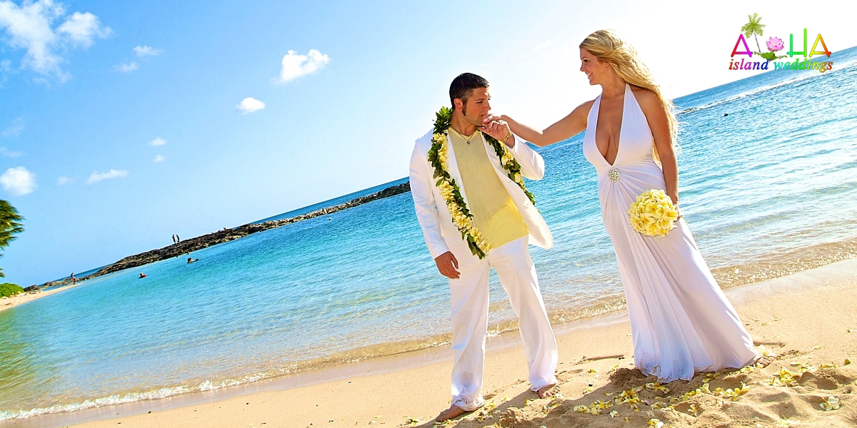 kissing her hand with yellow plumeria bouquet